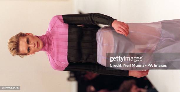 Transparent panelled skirt is teamed with a banded pink and black skinny-rib polo neck in this outfit from Amaya Arzuaga's Autumn/Winter 1997/8...