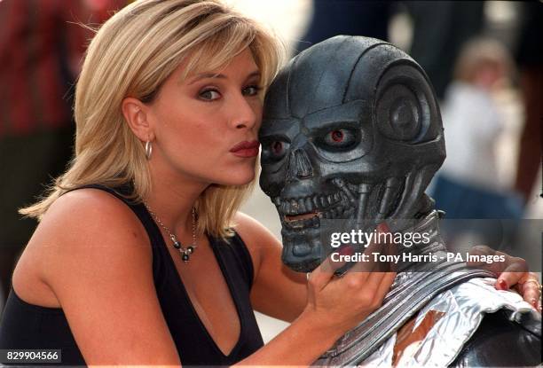 Beauty and the Beast......Model Samantha Fox comes face-to-face with an alien at the London International Book Fair this afternoon . Miss Fox, in the...