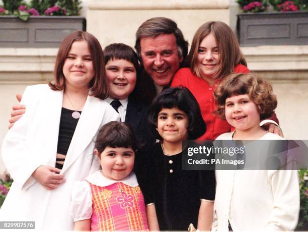 And radio presenter Terry Wogan surrounded by children who suffer from arthritis, during today's launch of the Charter for children with arthritis in...