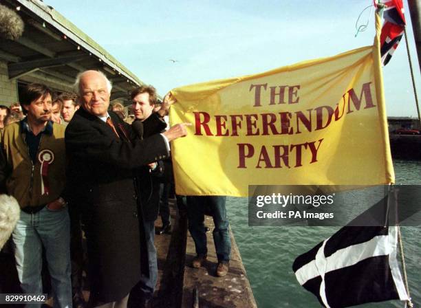 Sir James Goldsmith hoists a Referendum Party flag to launch the Party's campaign in the Cornish fishing port of Newlyn, St Ives today as Referendum...