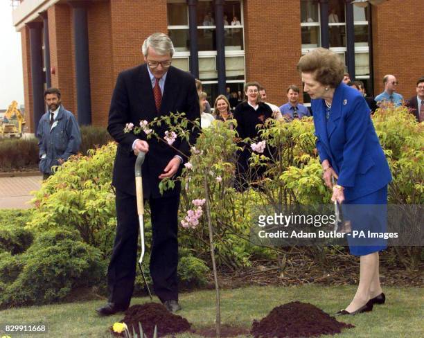 Prime Minister John Major and former Prime Minister Margaret Thatcher plant a tree during an election campaign visit to Stockton-on-Tees Wednesday...