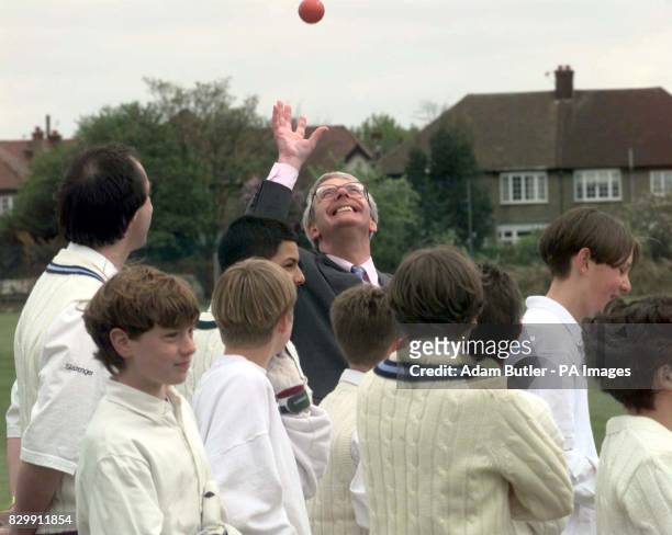 Prime Minister John Major catches a cricket ball during his visit to the Wilf Slack Memorial ground in Finchley, north London, this afternoon . Photo...