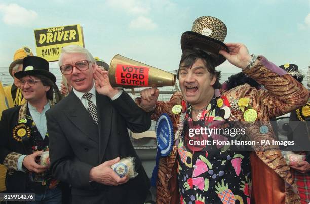 Prime ministerial look-alike Peter Friel listens as Screaming Lord Sutch, leader of the Monster Raving Loony Party, which is fielding thirty-five...