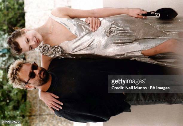 Director Luc Besson and actress Milla Jovovich during this photocall for the film "The Fifth Element" which Premieres tonight, at the 50th Cannes...