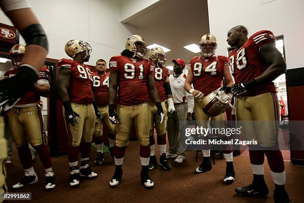 Defensive end Ray McDonald of the San Francisco 49ers meets with teammates in the locker room before the NFL game against the Detroit Lions on Bill...