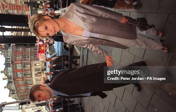 Julia Carling, the former wife of England rugby star Will Carling, and her boyfriend, Rob Stringer arriving at London's Dominion Theatre this evening...