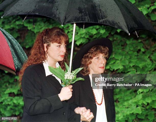 Laurie Lee's wife Cathy and daughter Jessye at his funeral in Slad, Gloucestershire today . Se PA Story FUNERAL/Lee. Photo Barry Batchelor/PA.