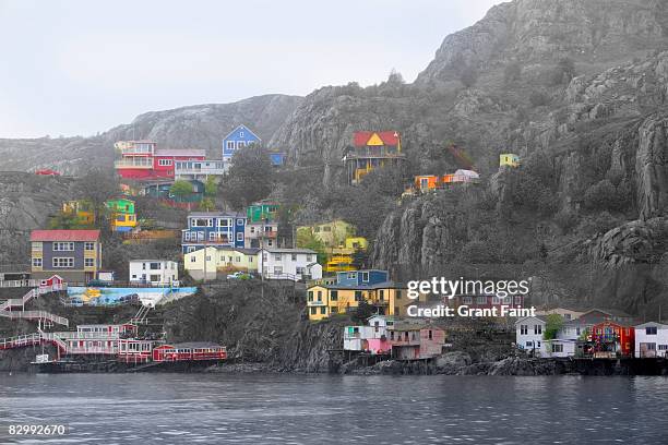 brightly colored houses near ocean - newfoundland and labrador stock pictures, royalty-free photos & images