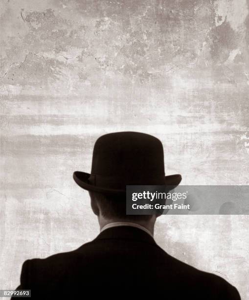 man in bowler hat rear view - bowler hat stock pictures, royalty-free photos & images