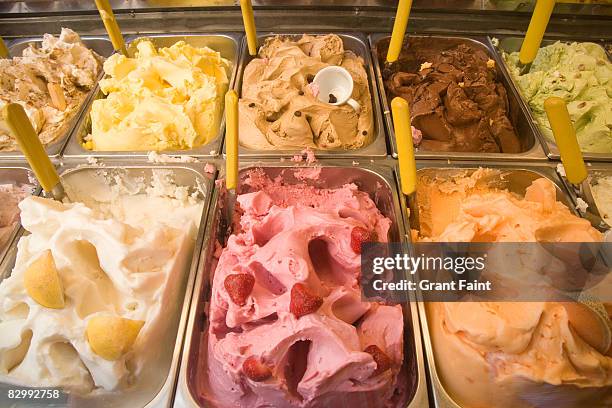 gelato display of many flavors - gelato stock-fotos und bilder