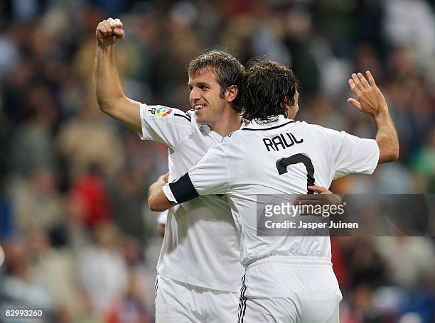 Rafael Van der Vaart of Real Madrid celebrates his third goal with Raul Gonzalez during the La Liga match between Real Madrid and Real Sporting de...