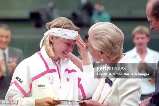 The Duchess of Kent comforts Jana Novotna as she presents her with the runner up trophy on centre court at Wimbledon. Novotna lost 6-7 6-1 4-6 to...