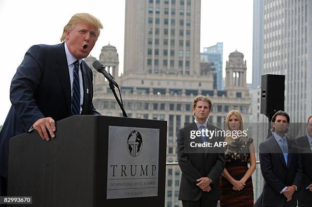 Real estate developer Donald Trump and his children Eric, Ivanka, and Donald Jr., attend a press conference at the Trump International Hotel and...