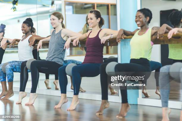 multi-ethnic group of women doing barre workout - hesitant to dance stock pictures, royalty-free photos & images