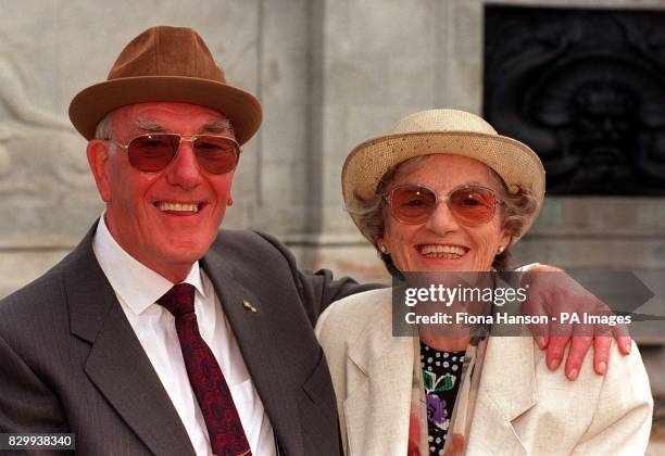 Golden Wedding couple Fred and Eileen Cooper, from Amesbury, Wilts, outside Buckingham Palace this afternoon before entering the grounds for a...