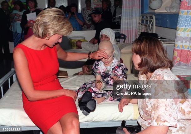 Diana, Princess of Wales, came face to face with a rival for attention called Camila today - and happily embraced her. Diana met four-year-old Camila...