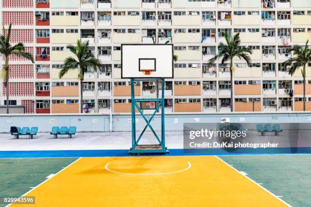 hong kong rainbow village basketball court - courtyard stockfoto's en -beelden