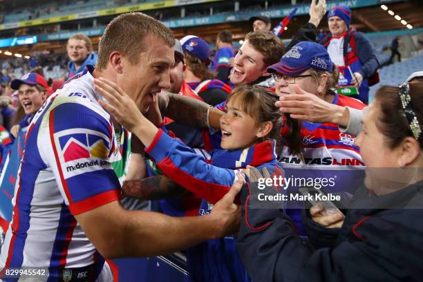 Trent Hodkinson of the Knights celebrates victory with the crowd during the round 23 NRL match between the Parramatta Eels and the Newcastle Knights...