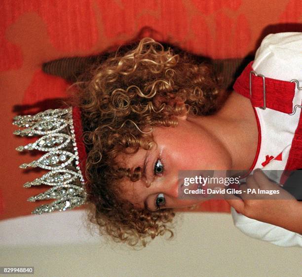 The final Miss Pears, three-year-old Ella Cox, from Bath, on the verge of tears shortly after she was crowned in London, today . Photo by Dave...