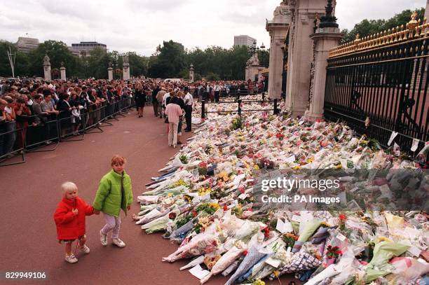 The crowds old and young and the flowers grow in number as mourners make their way to the gates of Buckingham Palce today to pay their respects to...