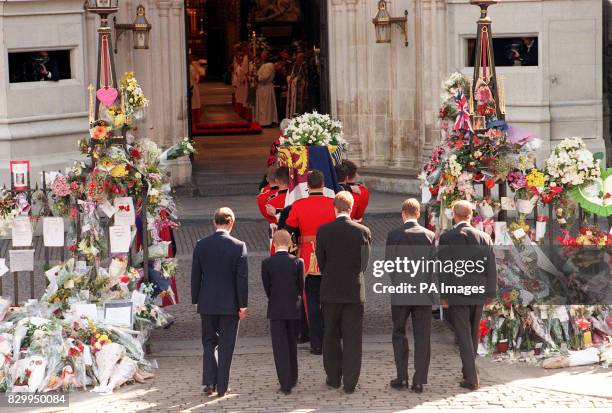 The coffin of Diana, Princess of Wales is carried into Westminster Abbey by the bearer party of Welsh Guardsmen for her funeral this morning ,...