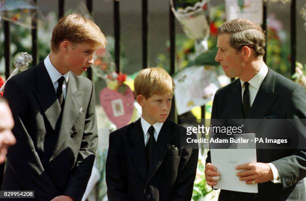 The Prince of Wales, Prince William and Prince Harry wait outside Westminster Abbey for Diana, the Princess of Wales' coffin to enter the Abbey.