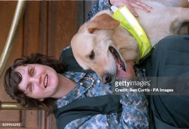 Elaine Noad from Ayr, Scotland poses with her guide dog Kappa during a photocall in London after winning of the prestigious Frink Award for blind and...