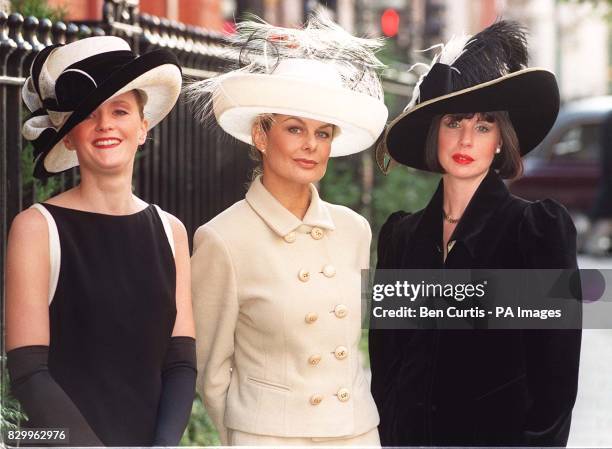 Alexis Butcher, Jilly Johnson , Tracey De Bruyne don Herbert Johnson hats as they arrive for the charity "Mad Hatter's Tea Party" at Claridges,...