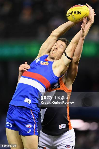 Robert Murphy of the Bulldogs marks infront of Lachie Whitfield of the Giants during the round 21 AFL match between the Western Bulldogs and the...