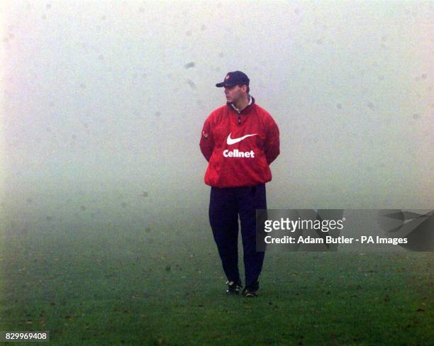New England Coach, Clive Woodward in a pensive mood during foggy training in Roehampton this morning as the England rugby team train for their match...