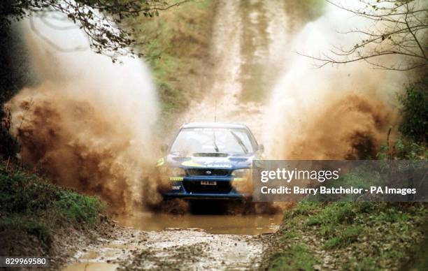 Colin McRae takes his Subaru through a watersplash during a demonstration near Great Tew, Oxfordshire today . Photo Barry Batchelor/PA