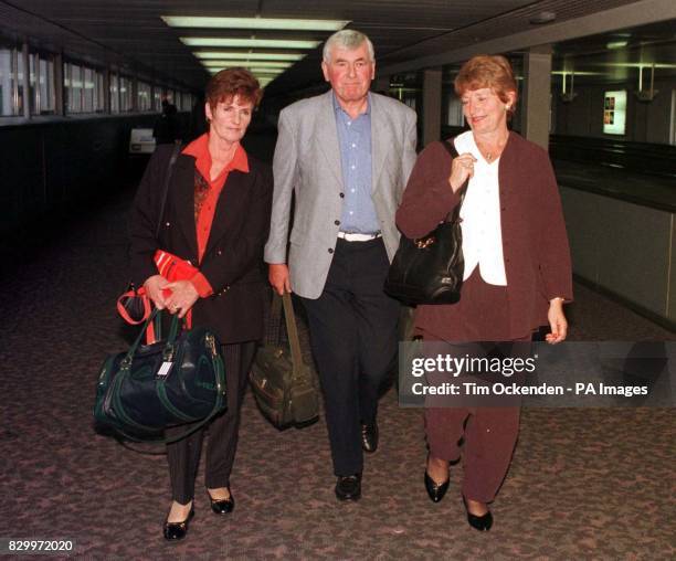 Happy to be back in England - John and Norma Tysone from Northampton and Margaret Goatley from the Isle of Aran arrive back at Heathrow Airport today...