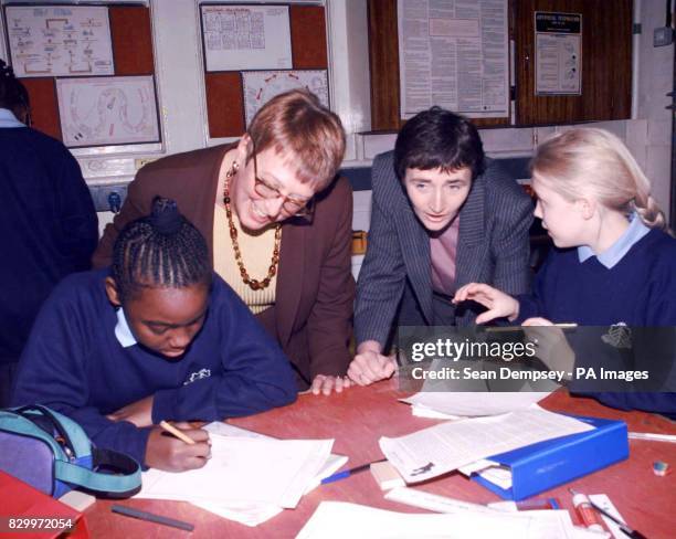 Schools Minister, Estelle Morris, and headteacher at The Sarah Bonnell School, Carolyn Brown, talk with pupils Stephanie Garrettage, 12 and Leana...