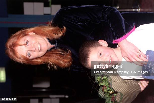 The Duchess of York with eight-year-old Danny Monty, who presented the Duchess with a bouquet upon her arrival for The Hallelujah Christmas Concert,...