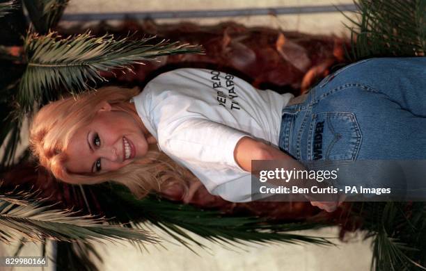 Page Three girl Melinda Messenger poses for the media in the Water Garden of the Hyatt Carlton Hotel in London after being voted Britain's Rear of...