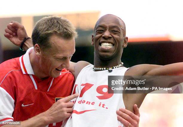Ian Wright celebrates his equalising goal with Lee Dixon at Highbury, against Bolton Wanderers this afternoon , to equal the goal-scoring record of...
