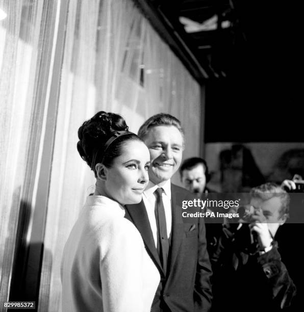 Elizabeth Taylor and Richard Burton, who play man and wife in the "The V.I.P.'s" the new film being made at MGM's British studios at Borehamwood,...