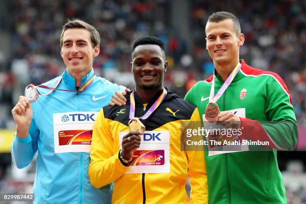 Silver medalist Sergey Shubenkov of Authorised Neutral Athletes, gold medalist Omar McLeod of Jamaica and bronze medalist Balazs Baji of Hungary pose...