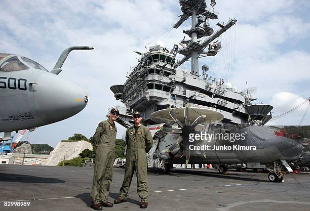Pilots stand on the deck of the USS George Washington upon its at Yokosuka U.S. Navy Base upon its arrival on September 25, 2008 in Yokosuka,...