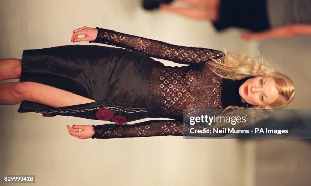 Model wears a polo-neck in lace mixed with black, silk, side spilt skirt from the Autumn/Winter collection by Ireland based designer, John Rocha, on...