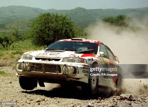 Mitsubishi Lancer driven by Britain's Richard Burns in action during the Safari Rally in Nairobi today . This year's Safari was the shortest in the...