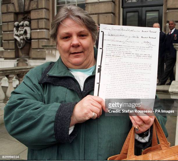 Margaret Godsell, holds up a copy of Diana, Princess of Wales' will outside Somerset House, after the will was published today by lawyers Lawrence...