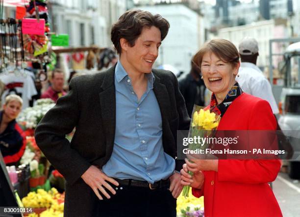 Actor Hugh Grant presents former actress Glenda Jackson, now Minister of Transport for London, during a visit to the set of his latest film on...