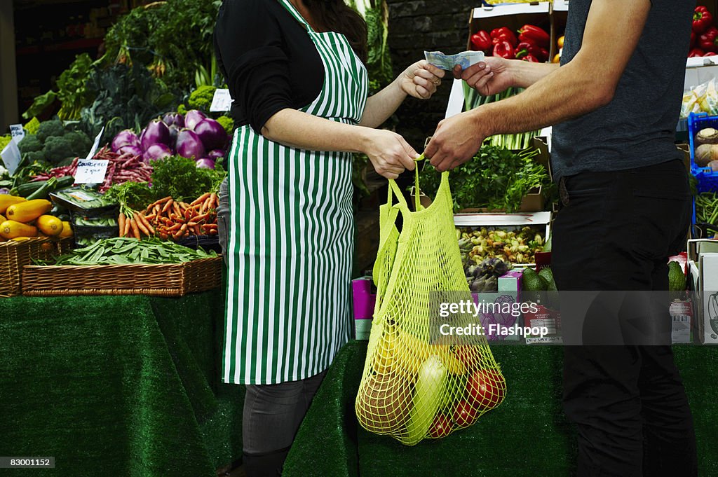 Portrait of man buying fresh food at market