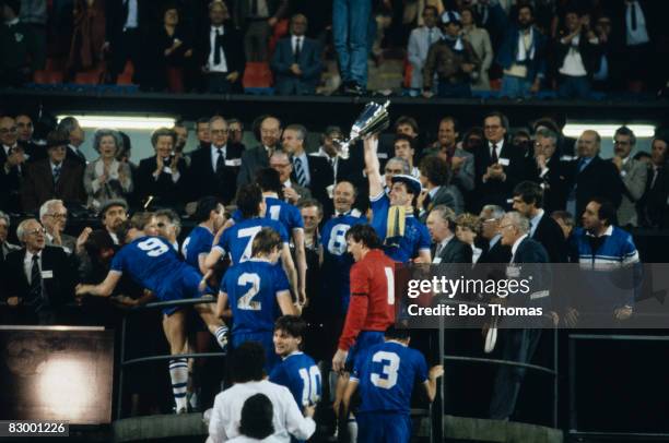 Everton captain Kevin Ratcliffe holds the trophy aloft after the presentation ceremony following their UEFA European Cup Winners Cup Final victory...