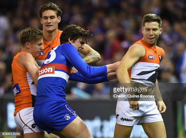 Lewis Young of the Bulldogs remonstrates with Toby Greene of the Giants after an incident with Luke Dahlhaus of the Bulldogs during the round 21 AFL...