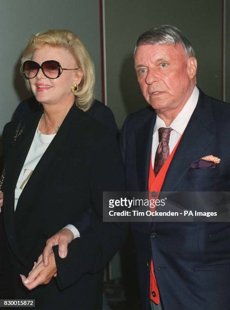 Library filer ref 253040-1 of veteran American singer, Frank Sinatra with his fourth wife, Barbara Marx arriving at London's Heathrow Airport....