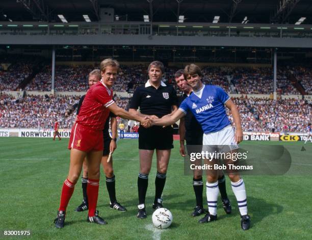 Liverpool captain Phil Neal shakes hands with Everton's Kevin Ratcliffe prior to the FA Charity Shield match at Wembley Stadium, August 18th 1984....