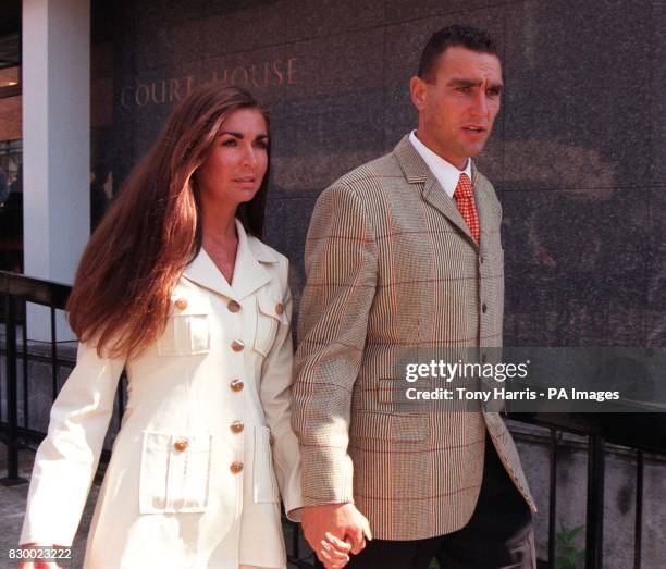 Vinnie Jones, assistant player/manager at Queen's Park Rangers FC, leaves St Albans magistrates court with his wife Tanya today , after being found...