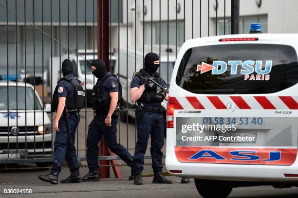 French special police officers stand guard at the entrance of the Georges Pompidou Hospital in Paris, on August 11 where the suspect in the attack of...